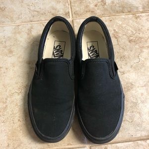 All black slip on vans